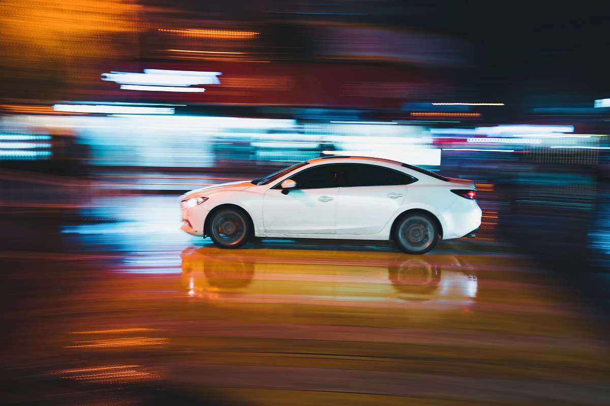 sports car timelapse photography of white sedan automobile